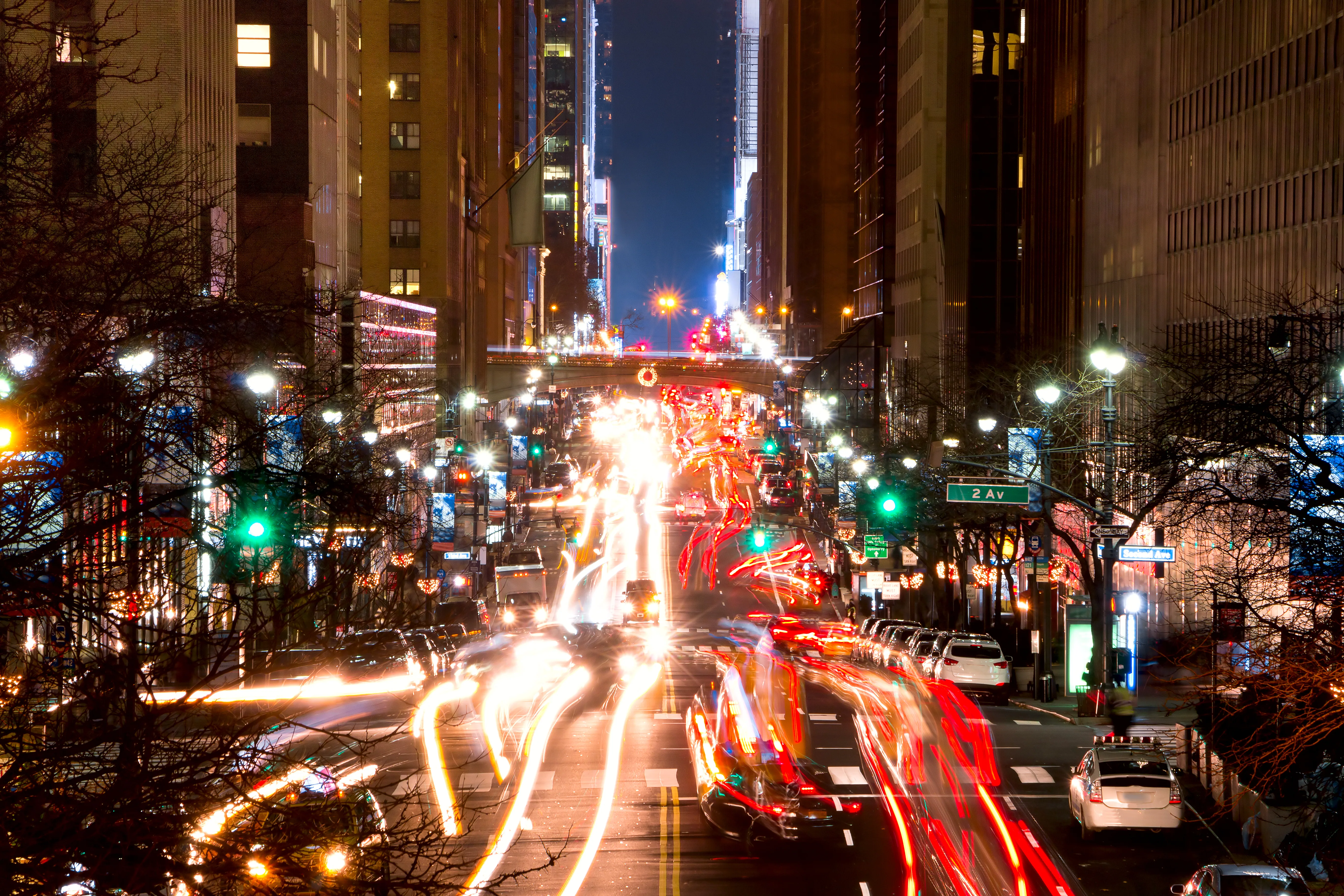 New York nightlife neighborhoods — 42nd Street traffic light trails at night, Manhattan